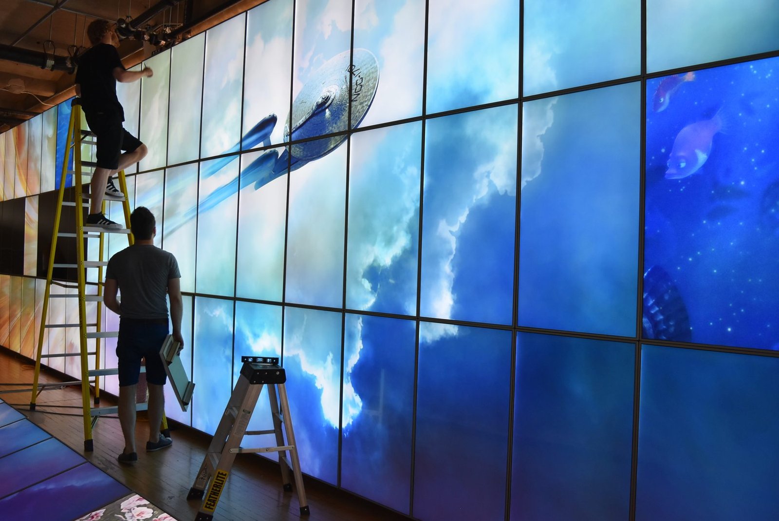LCD Design and Commercial Integration at Scale: The ArcLight Cinemas StoryWall 12 ArcLight Cinemas LCD video wall, 96 portrait screens showing one image across the lobby