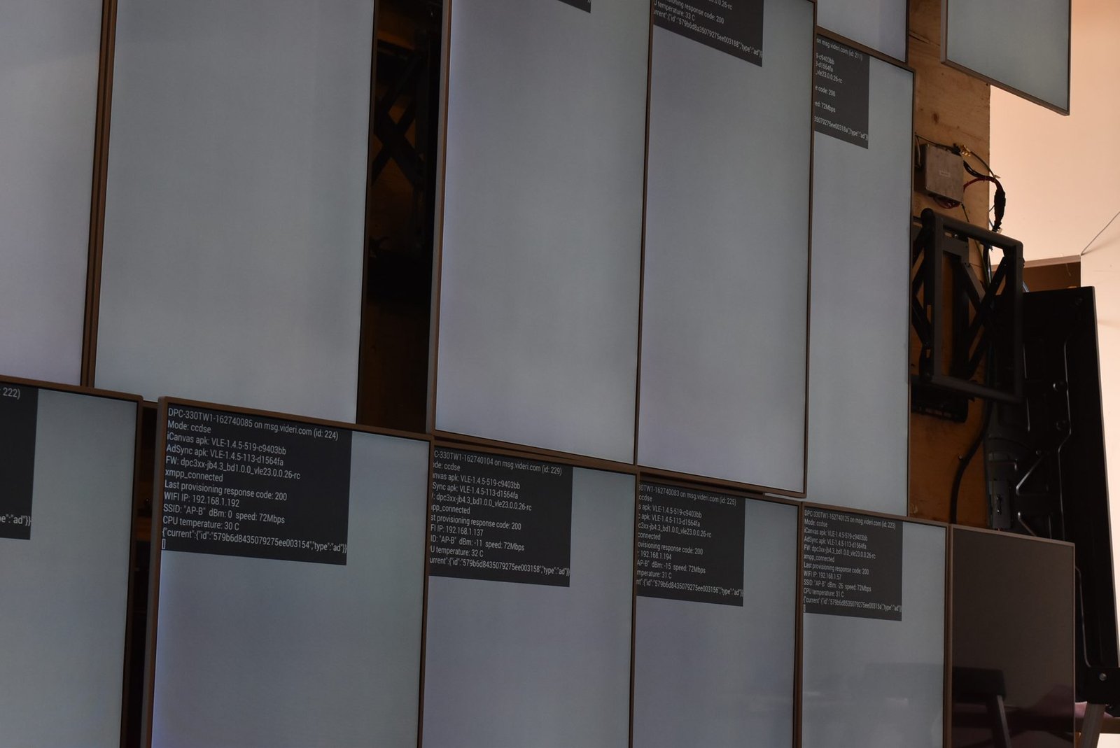 LCD Design and Commercial Integration at Scale: The ArcLight Cinemas StoryWall 6 Partially assembled LCD video wall with open positions showing mounts, Montreal staging