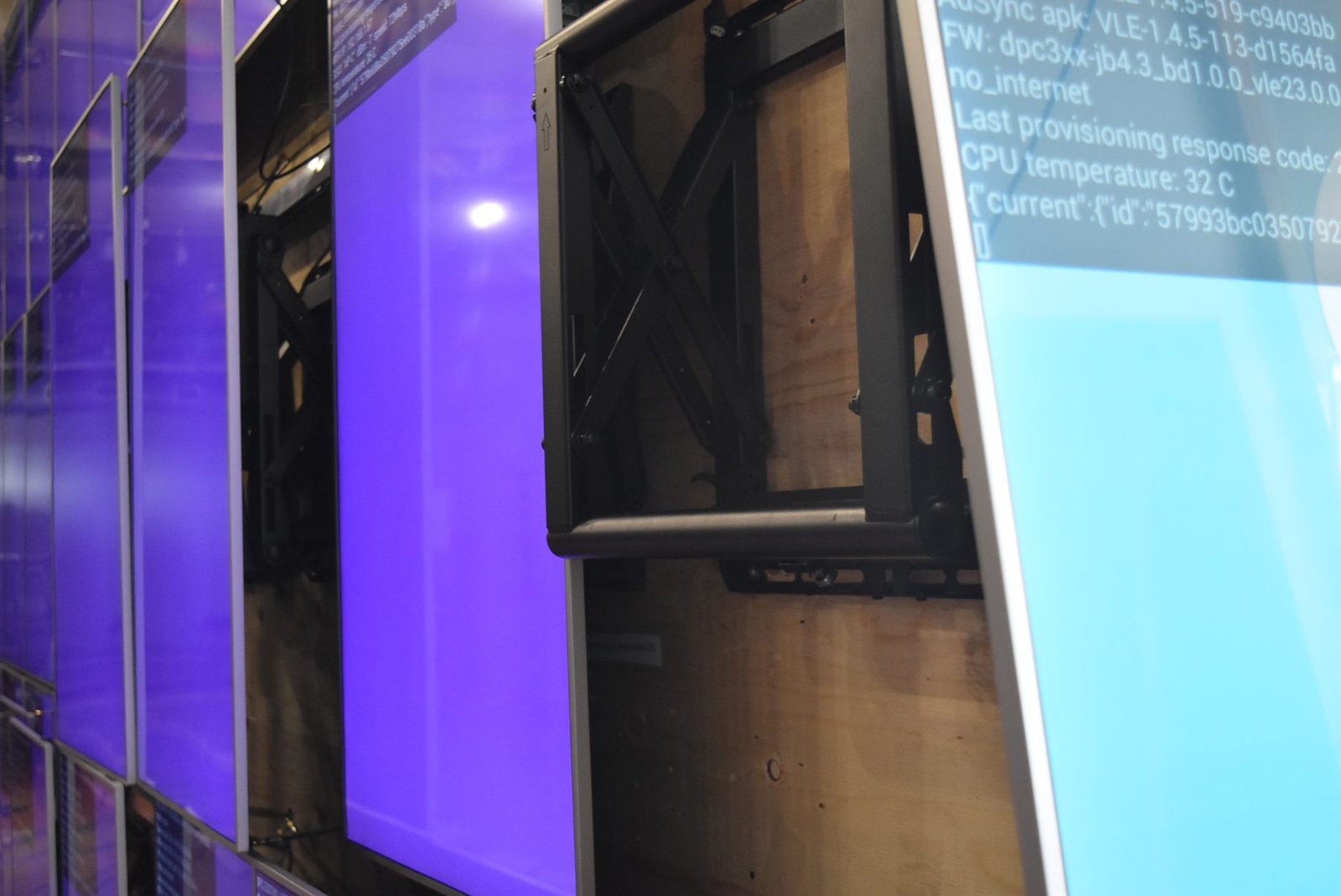 LCD Design and Commercial Integration at Scale: The ArcLight Cinemas StoryWall 5 Portrait screen extended on its press-and-release mount for service on the LCD video wall