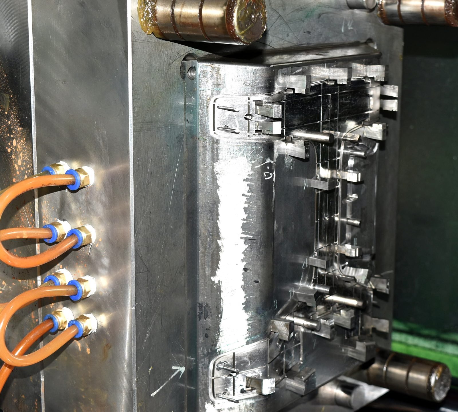 Product Design Challenges Behind the Tstand Base: Ergonomics, Sink Marks, Snap-Fits, and Lifters 19 The same Tstand base injection mold mounted in the molding press, with the ejector forward and the injection mold lifters pushed out of the core